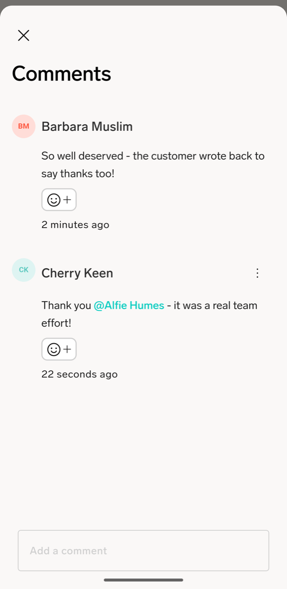 The Comments sheet on a Cheer in the flair mobile app, with a colleague's comment, a reply that mentions a coworker, and the Add a comment field