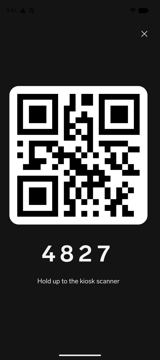 The enlarged full-screen Kiosk QR code with the PIN and the Hold up to the kiosk scanner hint